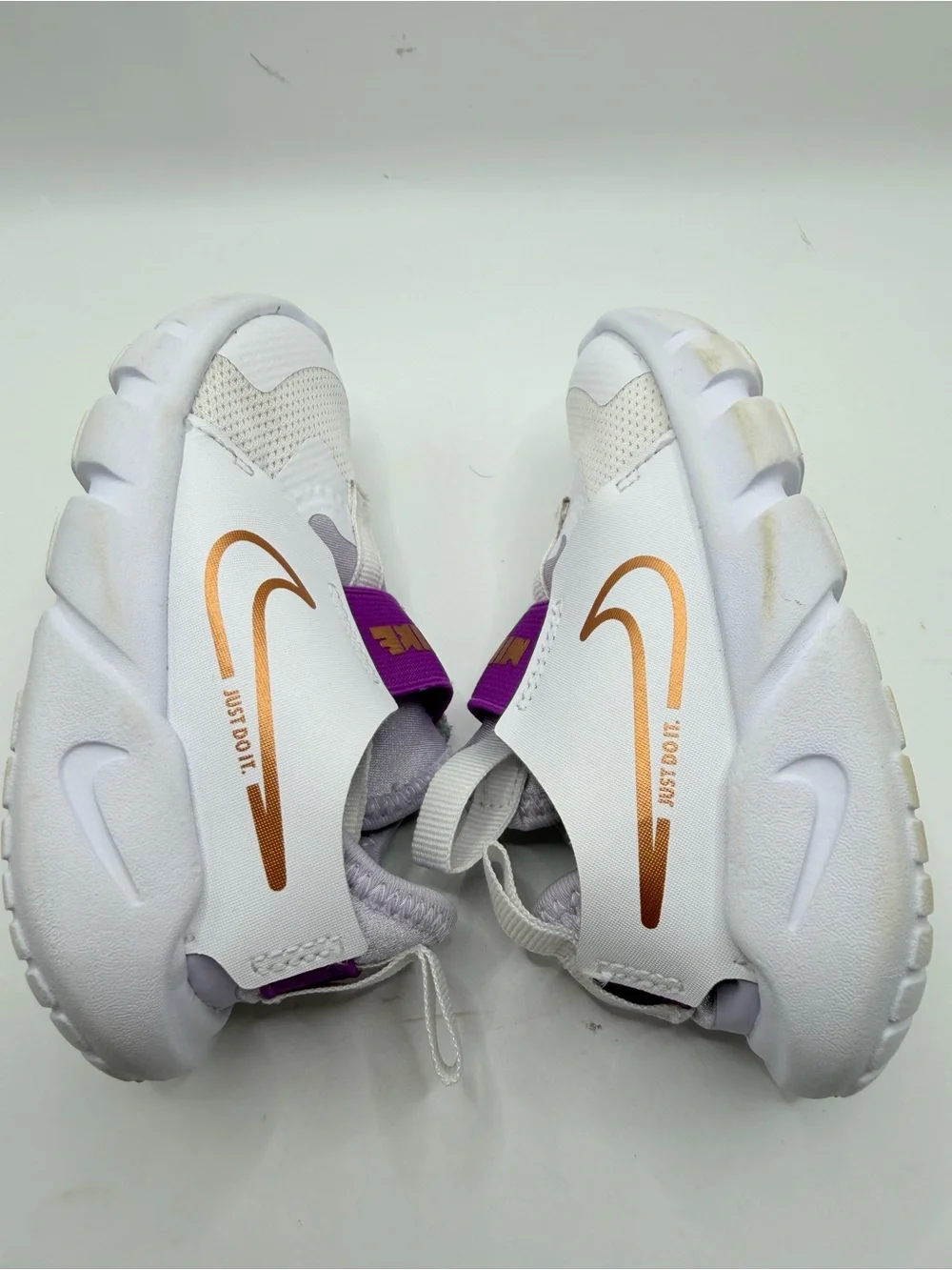 Nike Kids White Sneakers with Purple Strap and Gold Swoosh